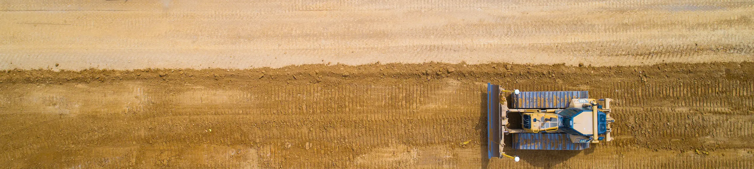 Aerial view of a road being prepared with sand